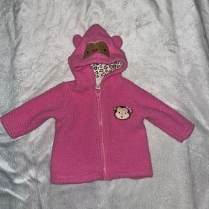 Pink hooded jacket with monkey face and ears on the‎ hood. Size 0-3mos